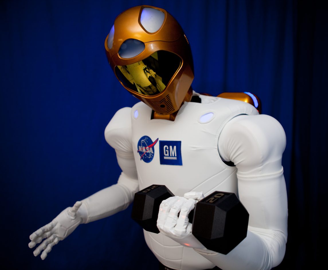 Robonaut working on its guns