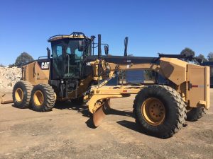 Full side shot Caterpillar 140M motor grader