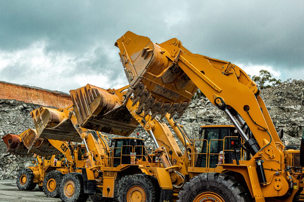 Caterpillar 988 model wheel loaders lined up